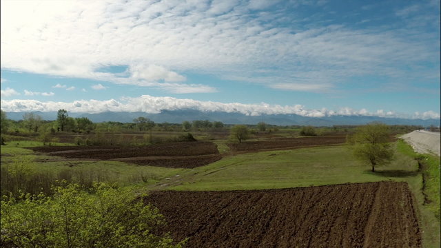 Scenic view of beautiful nature with road under cloudy sky, Georgia, Guria