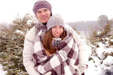 Young adult couple in park in winter