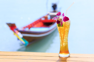 Ice tea. Tropical cocktail on long tail background Thailand Samui
