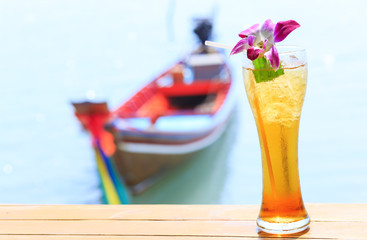 Ice tea. Tropical cocktail on long tail background Thailand Samui