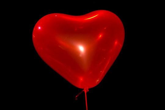 Valentine red heart balloon on black background
