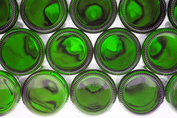 Beer bottles of green glass background, glass texture