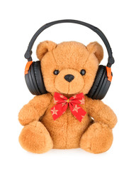 Teddy bear with headphones isolated on white