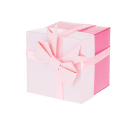 Pink gift box with ribbon bow isolated on white background