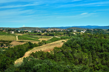 Small town in the hills of vineyards in France.