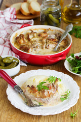 Braised rabbit in a creamy sauce with mashed potatoes.