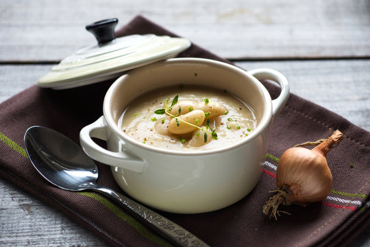 Creamy White Bean Soup On Wooden Background
