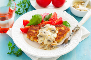 Baked chicken breast with a crispy crust and mushroom sauce.