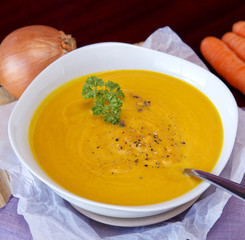 Fresh pumpkin soup with  vegetables .