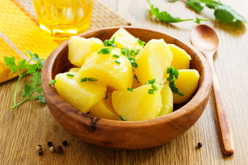 Boiled potatoes with green onions.