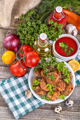 Meatballs of fresh meat with herbs, tomato sauce and vegetables