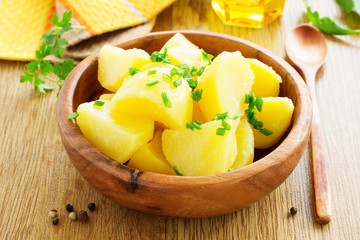 Boiled potatoes with green onions.