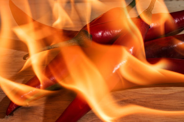 pile of burning red chili on the wood background