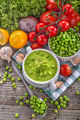Obraz na płótnie Canvas Potage soup made from fresh domestic peas with spices