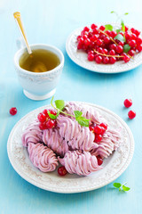 Homemade marshmallows with fresh berries.