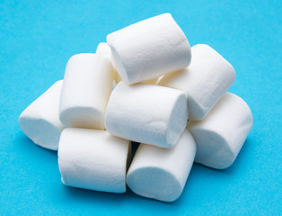 heap of marshmallow on blue