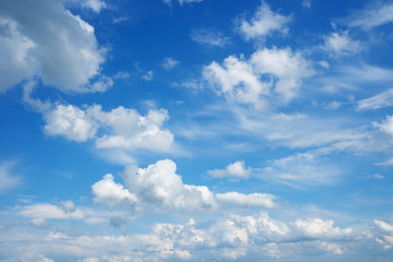 Naklejka na ściany i meble Beautiful cloudscape over horizon. Blue sky and clouds.