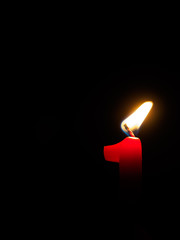 Close-up of candle light against black background