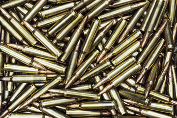 Background from military machine gun cartridges.