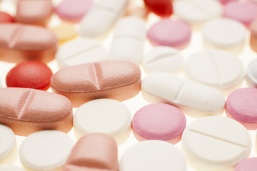 Macro photograph of various colorful medicinal pills