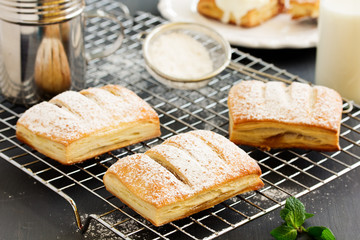 Homemade cakes and puff pastry with apples and caramel.