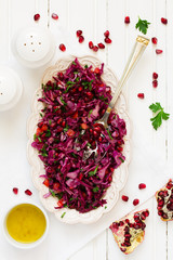Red cabbage salad with pomegranate seeds.