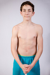 Teenage Boy Flexing Muscles 