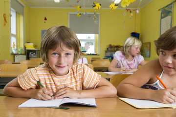 Children in a yellow classroom. 