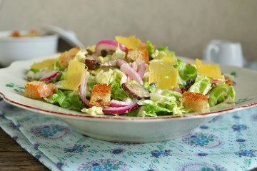 Chinese cabbage salad with croutons, cheese and delicate sauce