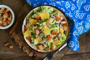 Chinese cabbage salad with croutons, cheese and delicate sauce