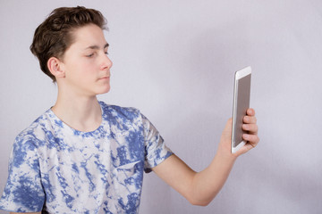 Teenage Boy Using A Smart Phone 