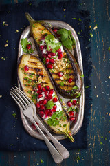 grilled eggplants with garlic yogurt sauce, walnuts and pomegran