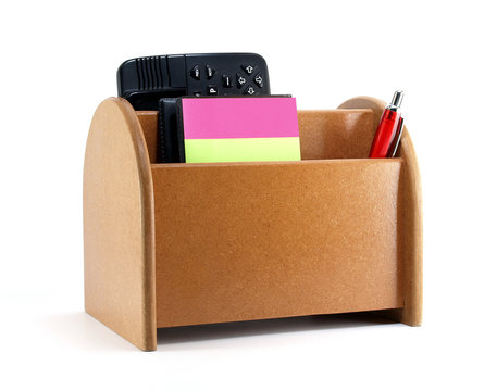 desk organizer with office supplies and electronic dictionary isolated on white