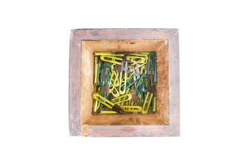 Scissors in wood box on isolated