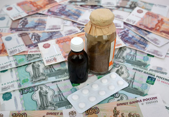 Packings of drugs lie on the Russian paper money