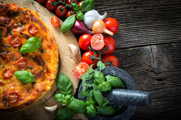 homemade pizza margherita with mozzarella, basil and tomatoes