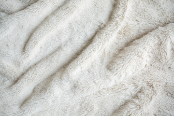 rippled white fur background and textile