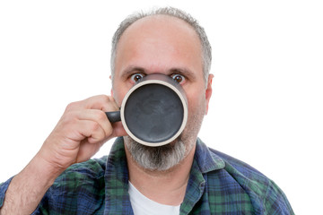 Fototapeta na wymiar Shocked man with cup in front of face
