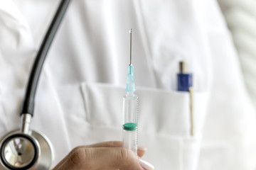 Close up of doctor with syringe