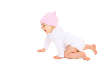 Cute smiling baby in hat crawls on white background