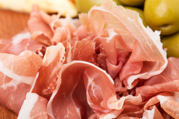 Delicious chopped prosciutto closeup.