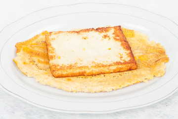 Fried plantain toston (patacon) with fried cheese