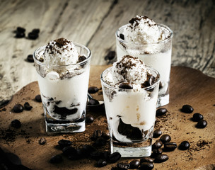 Sweet dessert with vanilla ice cream, chocolate cookies, coffee,