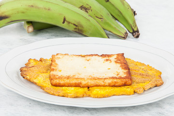 Fried plantain toston (patacon) with fried cheese © gonzalocalle