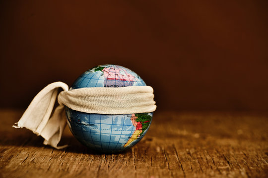 piece of cloth tied around a terrestrial globe
