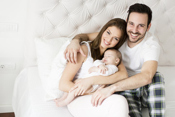 Happy family with newborn baby