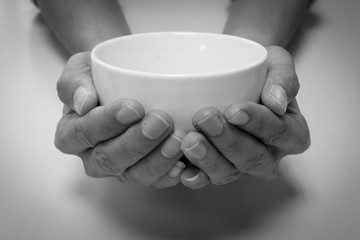 Hunger begging with white bowl