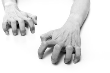 Hands crawling on white surface