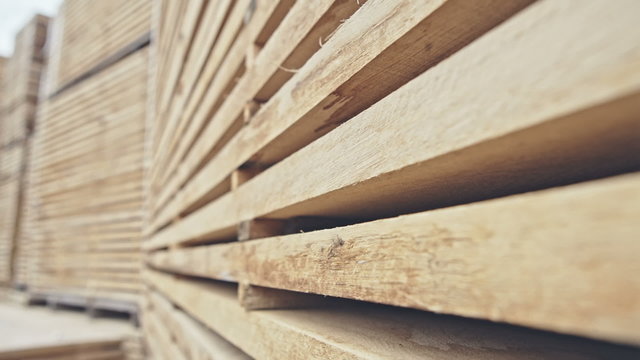 Wood stored in stock. Close-up. RAW video record.