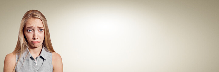 Closeup portrait stressed frustrated woman crying or weep having temper tantrum isolated on wall background. Negative human emotion facial expression reaction attitude. Free space for text.